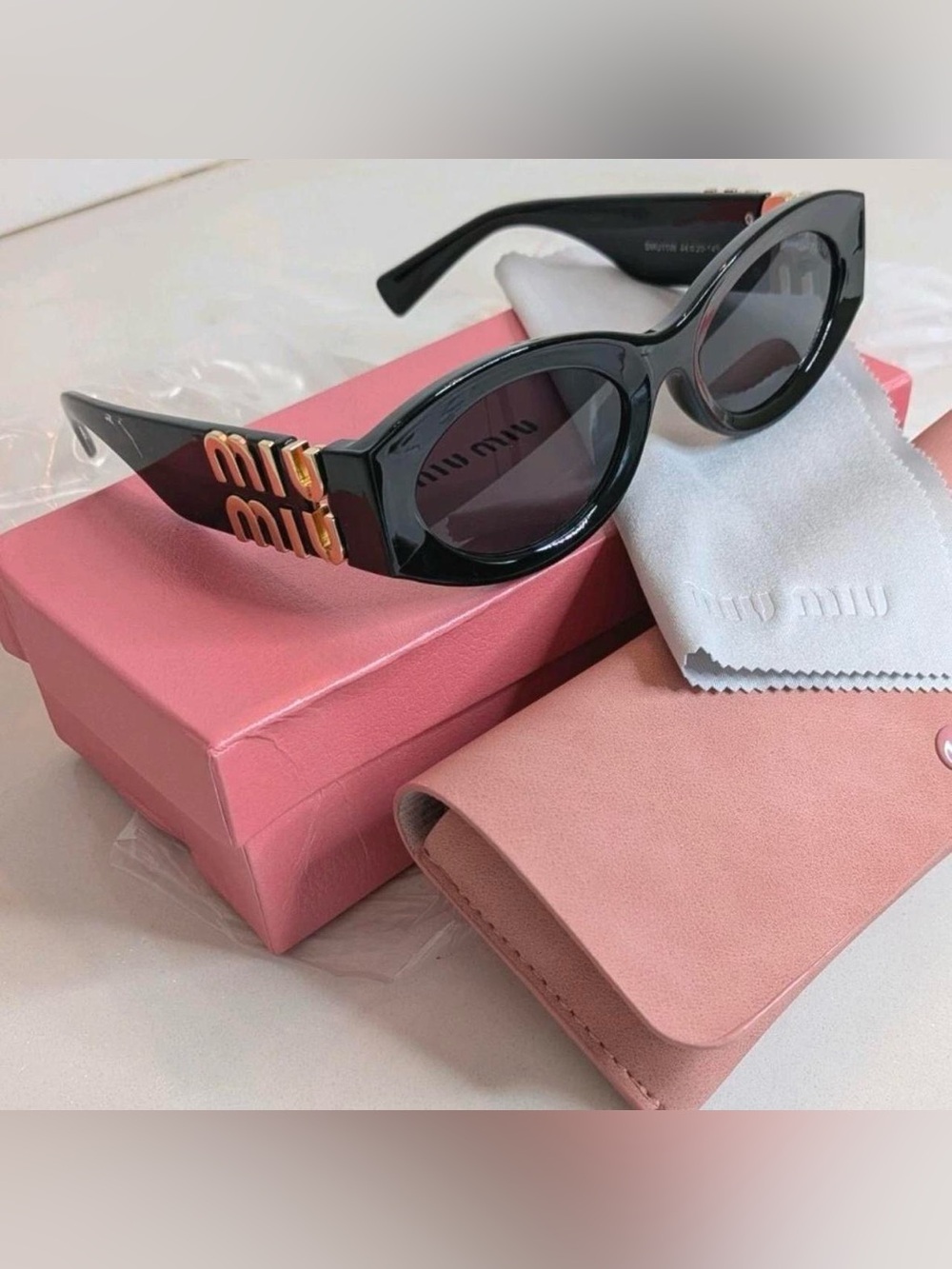 Miu Miu SMU11W Black Glimpse Square Cat Eye Sunglasses with Gold Logo